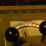 Close-up view of a vintage dashboard with a detailed gauge display, capturing an era of classic design.