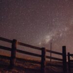 Scenic view of a star-filled sky with Milky Way visible over a fence in Paragominas, Brazil.